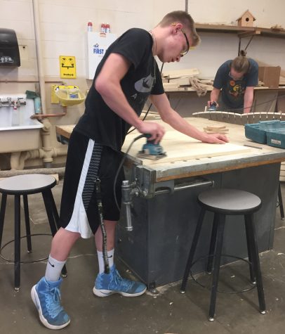 Students in woods class prepare for finals